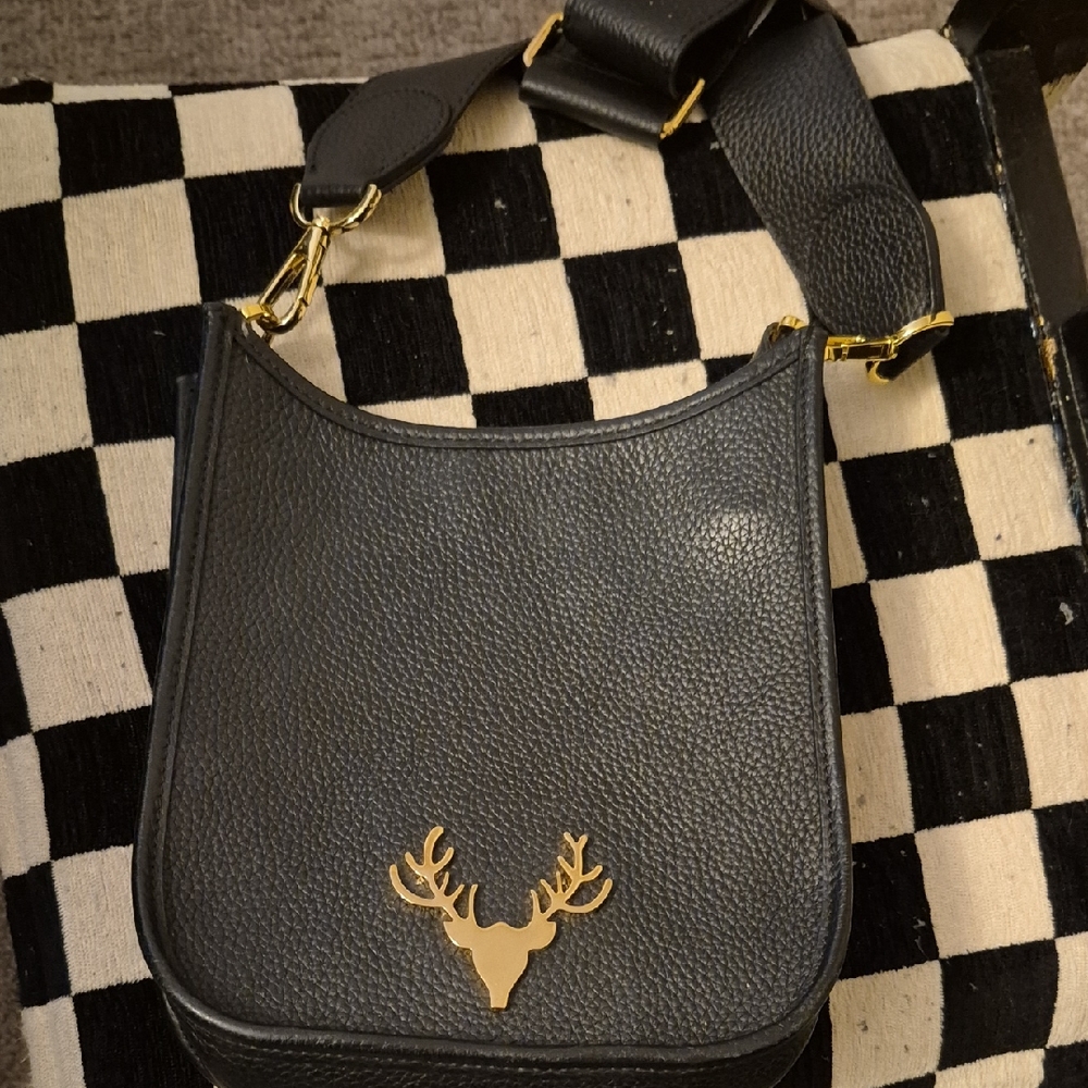 Elegant Black Crossbody Bag with Gold Deer Emblem